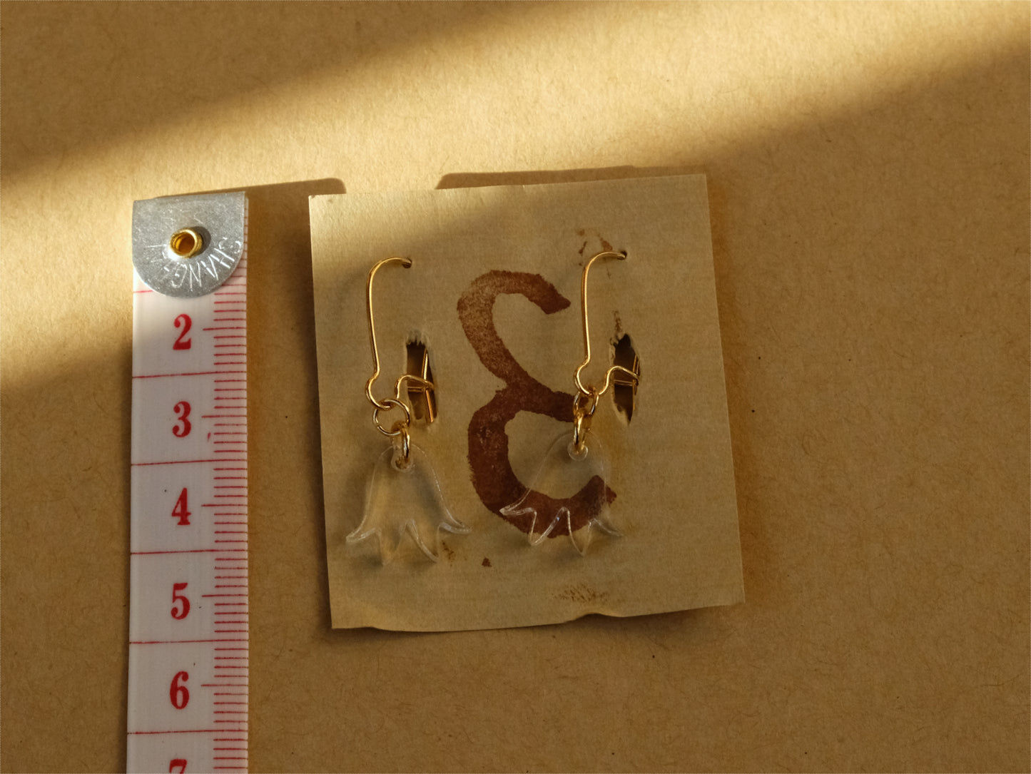 Earrings small transparent blue bells gold plated